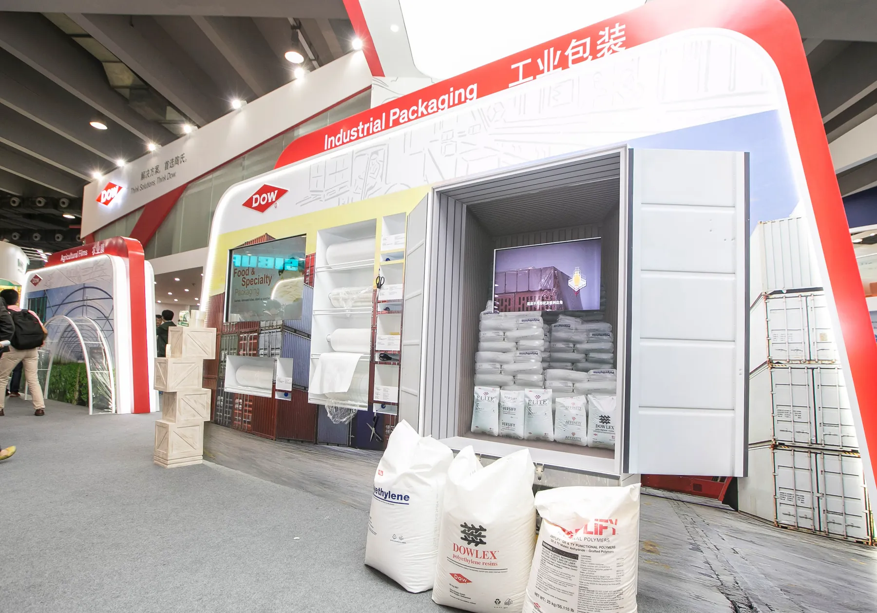 Dow ChinaPlas Industrial Packaging zone with bulk-material displays and bilingual overhead signage