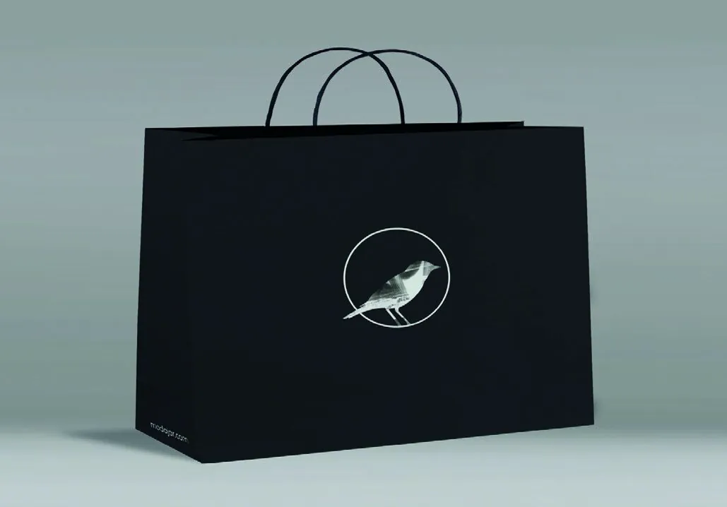 Black Modajar shopping bag featuring the circular bird emblem