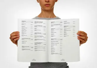 Oversized folded MUNCH menu held open to show the restaurant's editorial layout